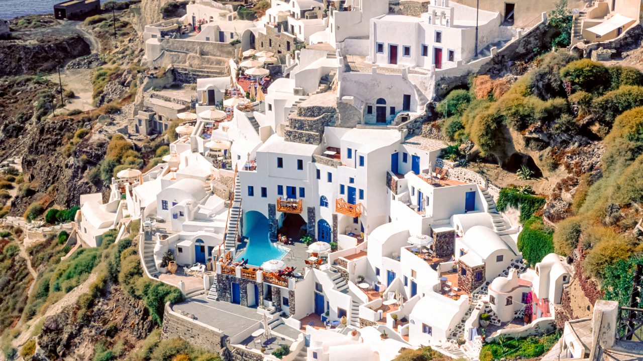 White buildings on a Greek island hillside.