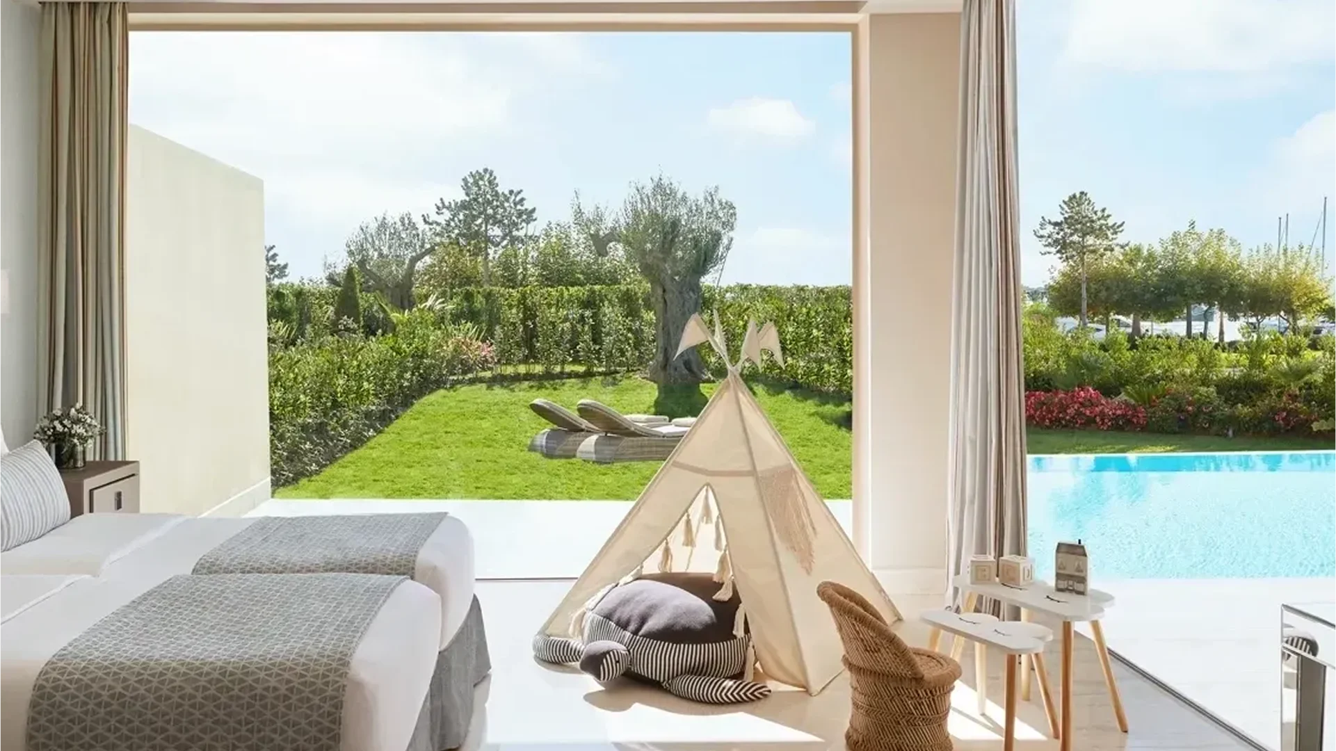 Cozy indoor kids' teepee tent near a sunny garden view.