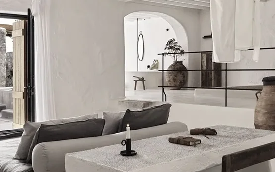 Minimalist living room with neutral tones and modern decor.