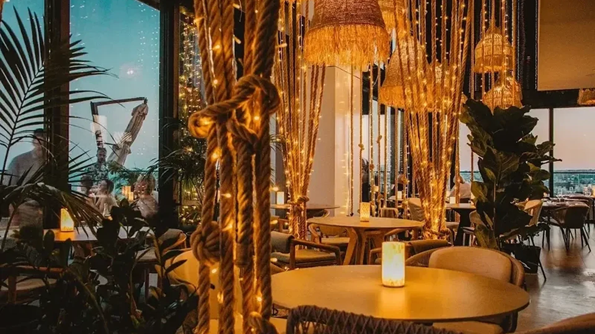 Cozy restaurant interior with warm lighting and golden decorations.