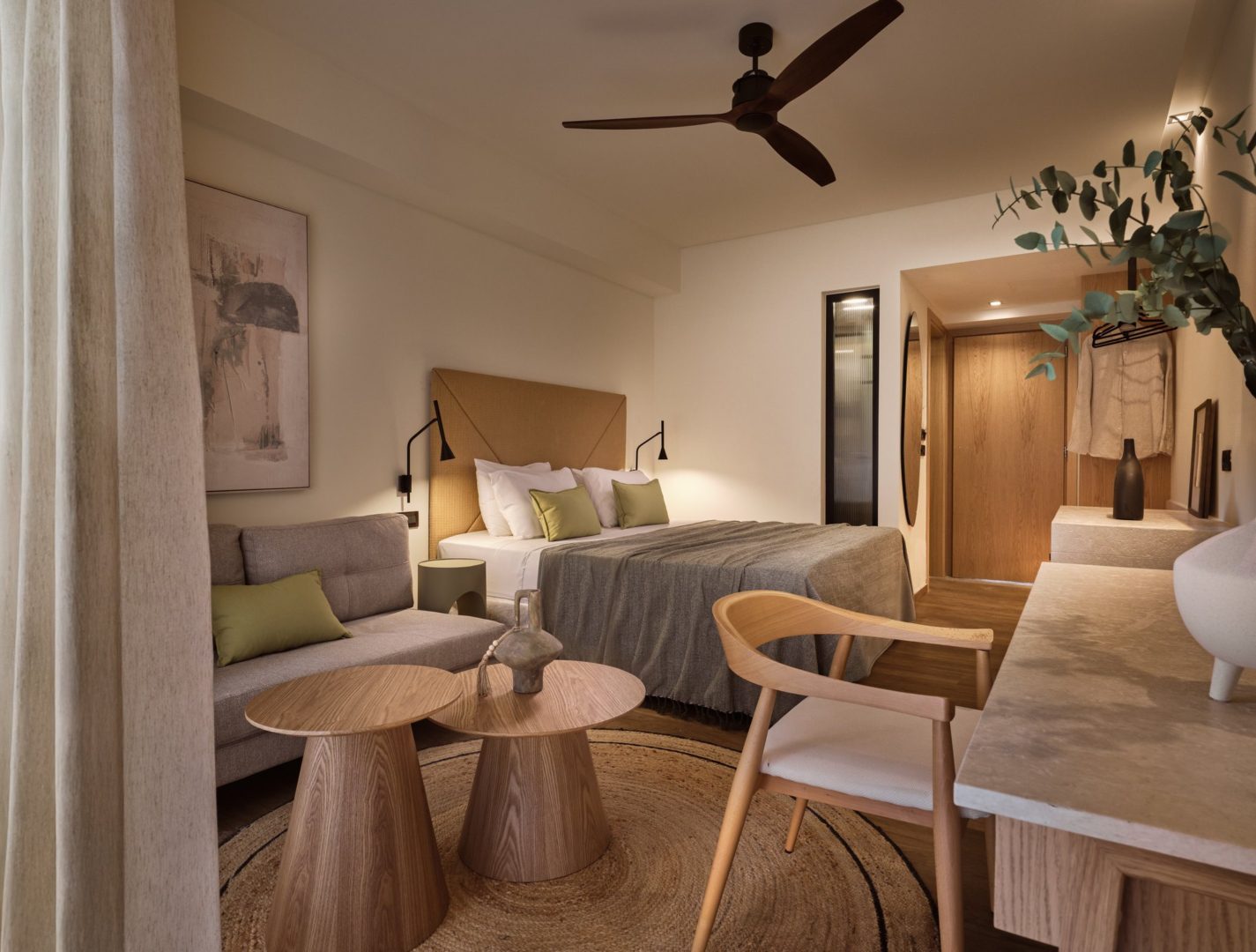 Cozy hotel room with modern furniture and warm lighting.
