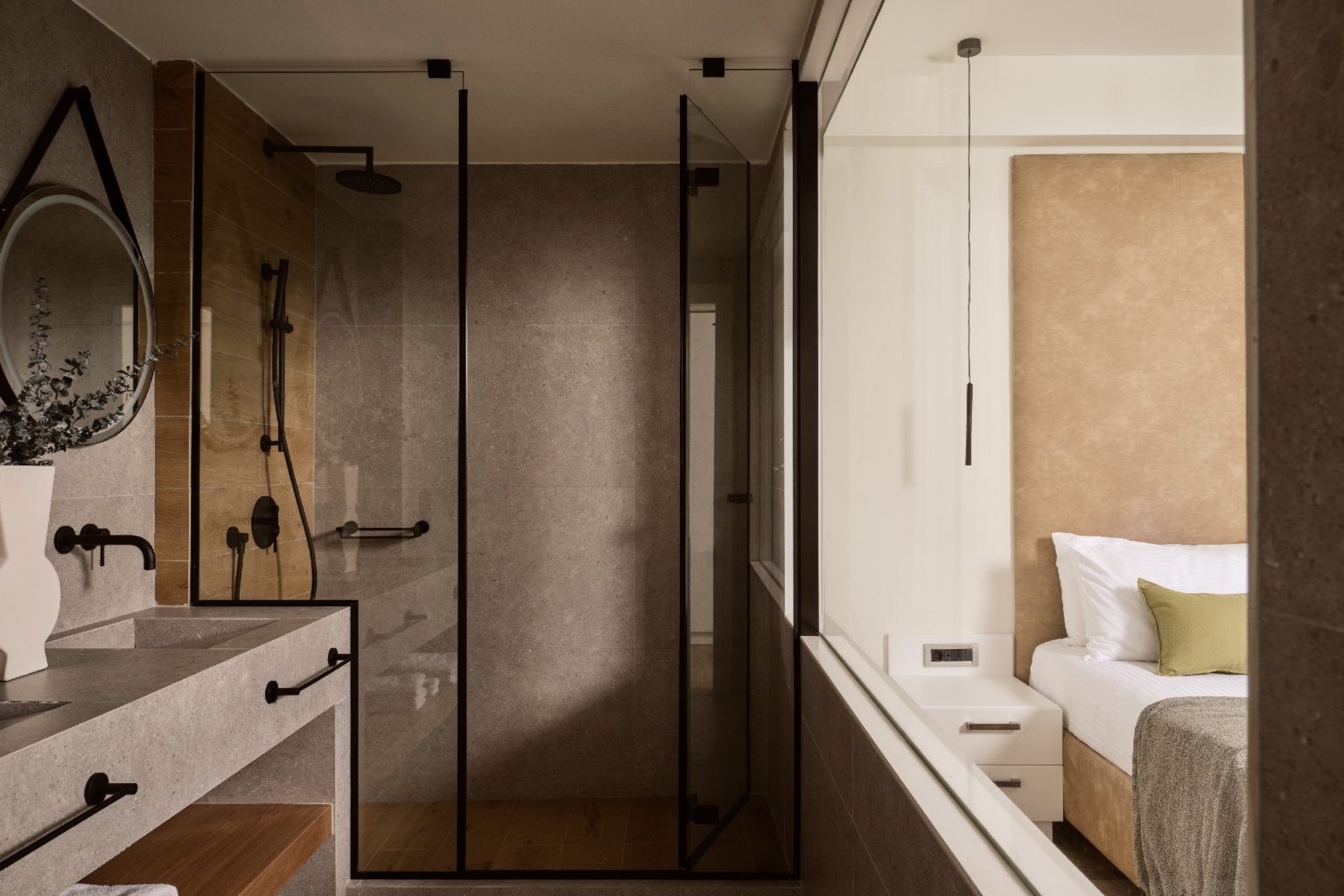 Modern bathroom with glass shower enclosure and sleek fixtures.