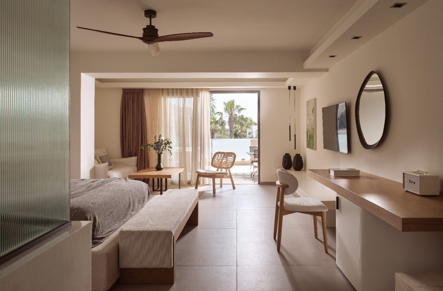 Bright, modern bedroom with neutral tones and natural light.