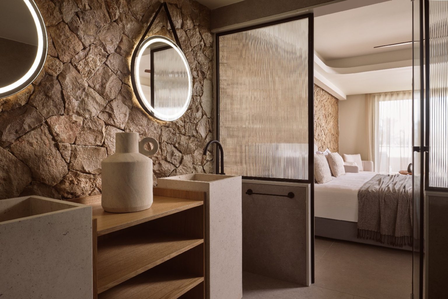 Cozy bedroom with stone accent wall and modern rustic decor.