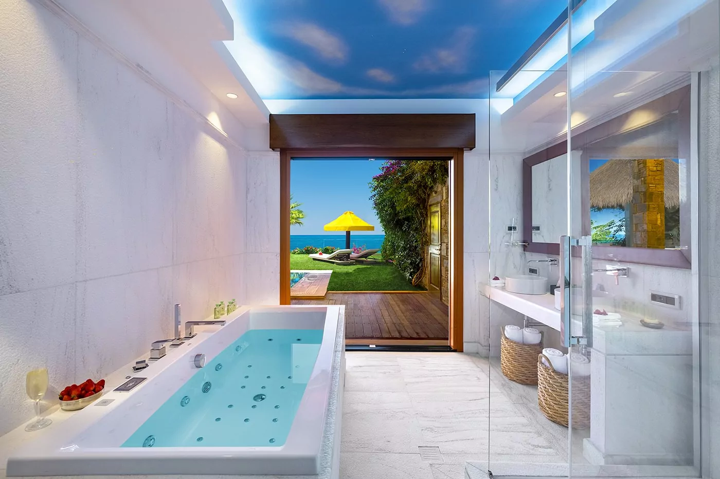Modern bathroom with a jacuzzi tub and ocean view.