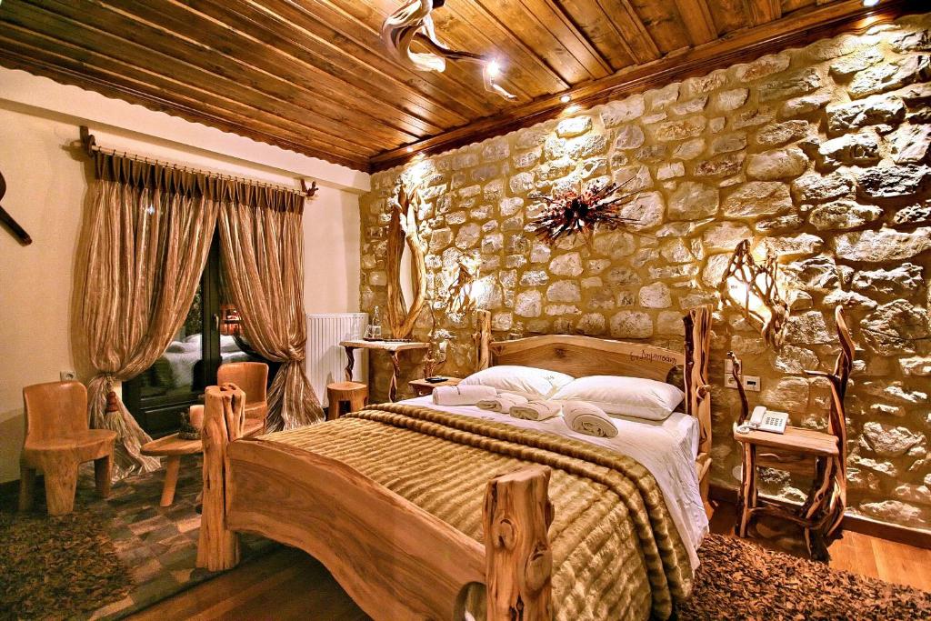 Cozy rustic bedroom with stone walls and wooden furniture.