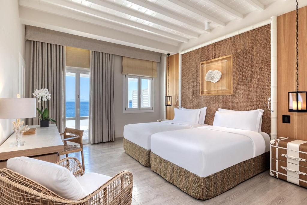 Bright, airy bedroom with twin beds and sea view.