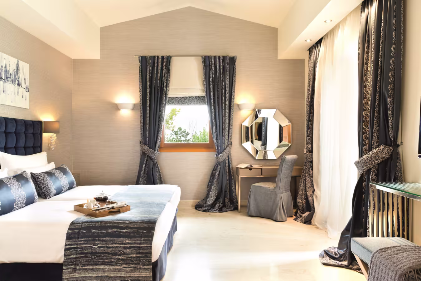 Cozy bedroom with elegant curtains and a vintage vanity table.