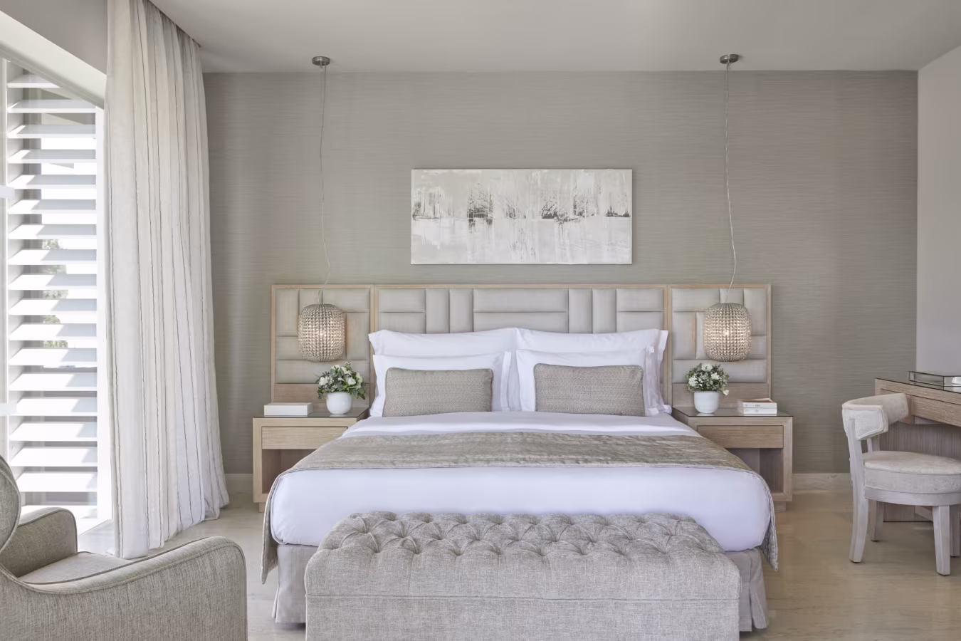 Modern bedroom with a neutral color palette and elegant decor.