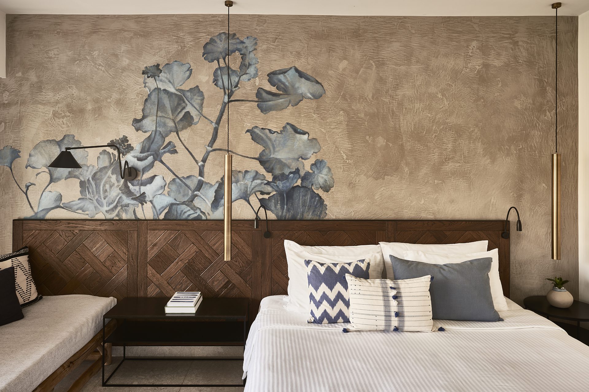 Modern bedroom with floral wall art and cozy bedding.