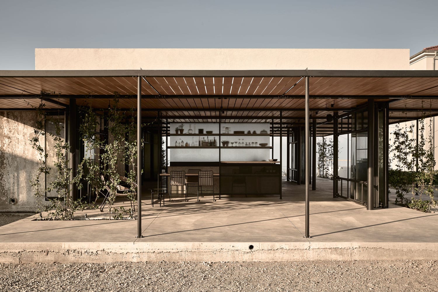 Modern outdoor bar with minimalist design and natural elements.