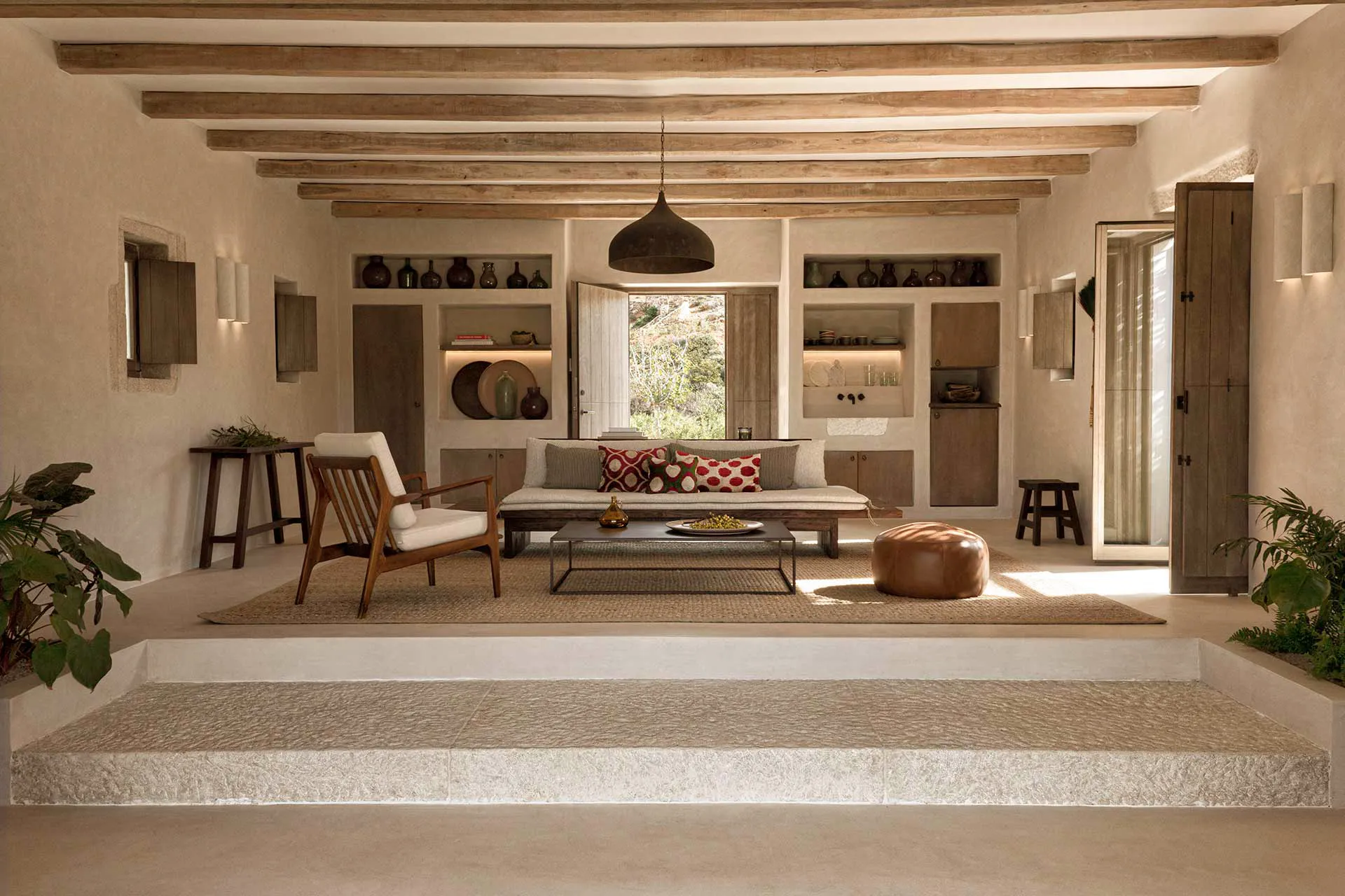 Cozy living room with wooden beams and neutral decor.