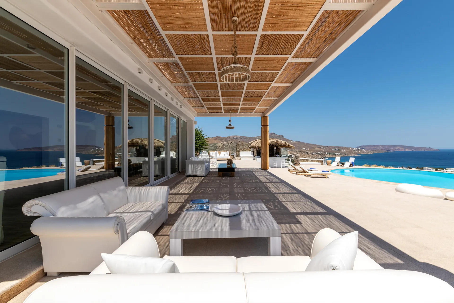 Modern outdoor patio with comfortable seating and ocean views.