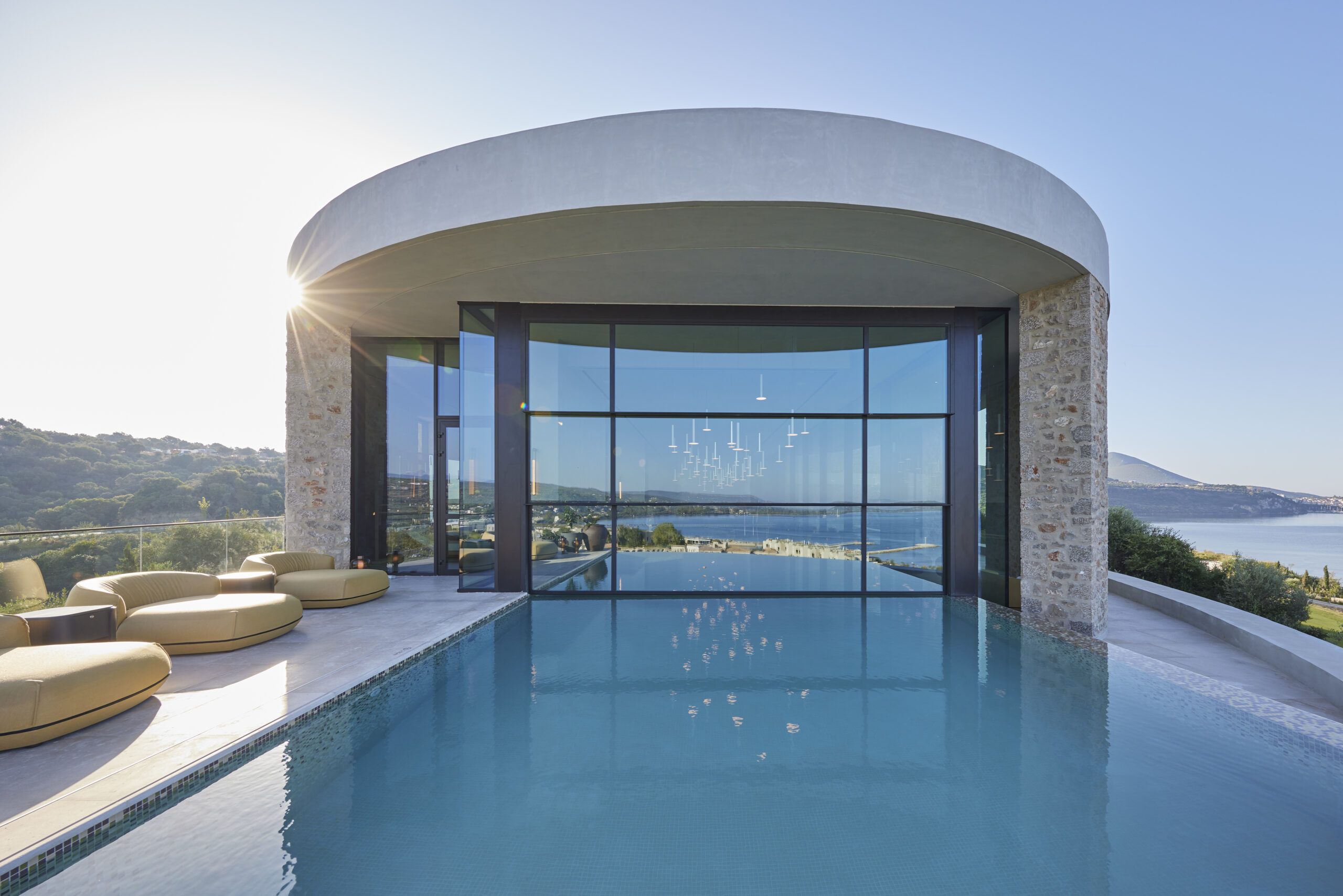 Modern infinity pool with panoramic ocean view and sleek architecture.