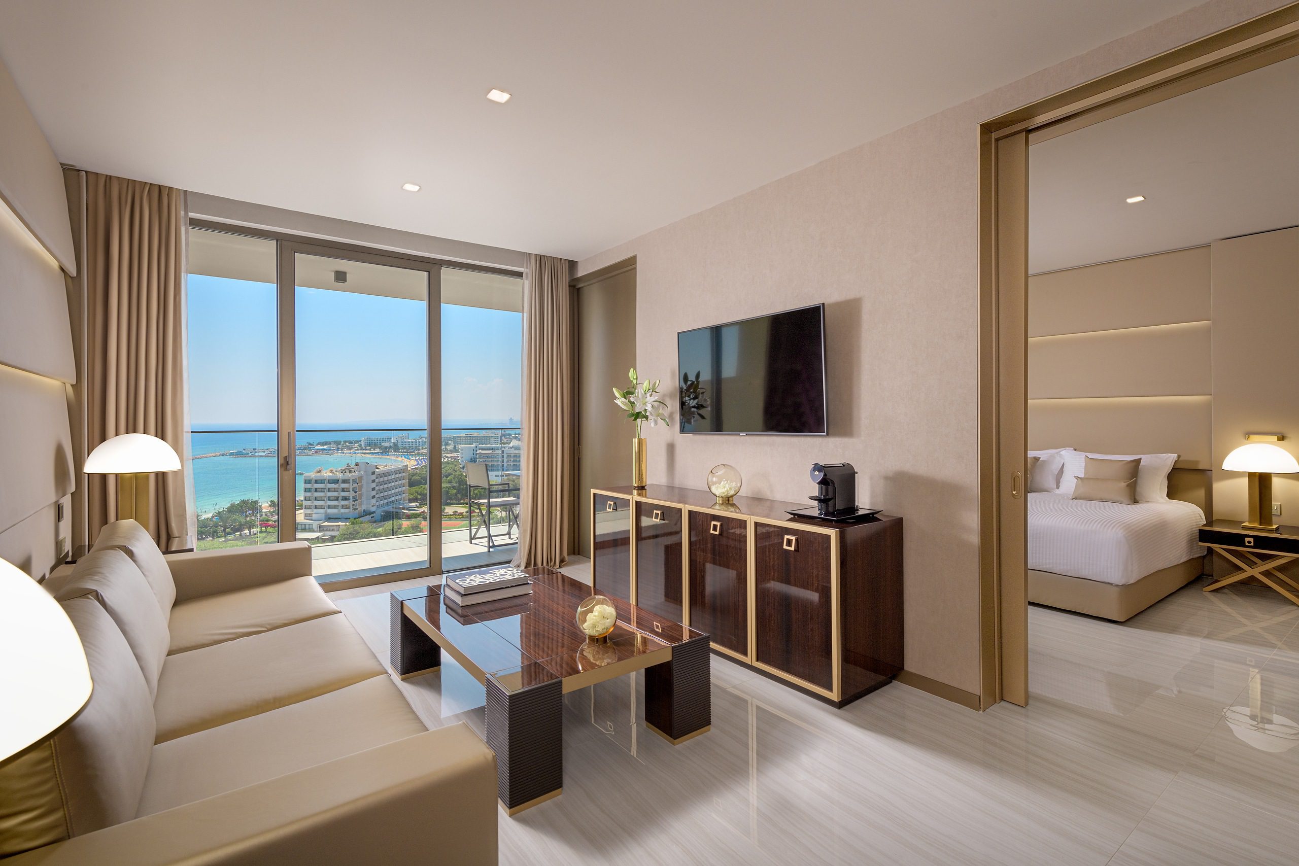 Modern living room with ocean view and stylish decor.