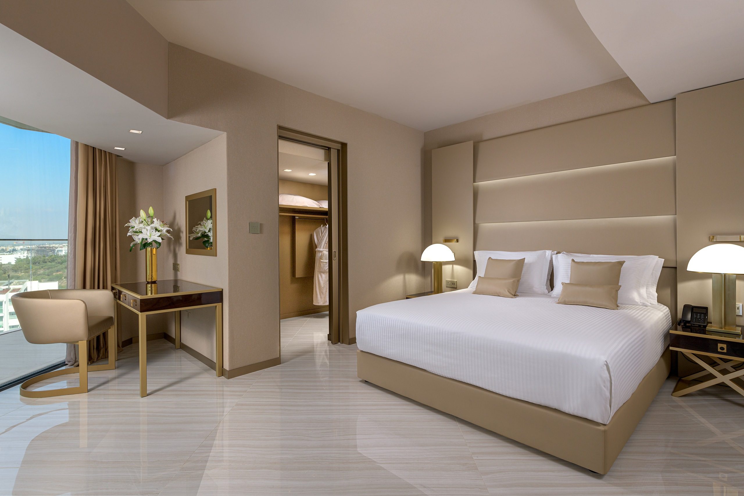 Modern hotel room with a cozy bed and elegant decor.