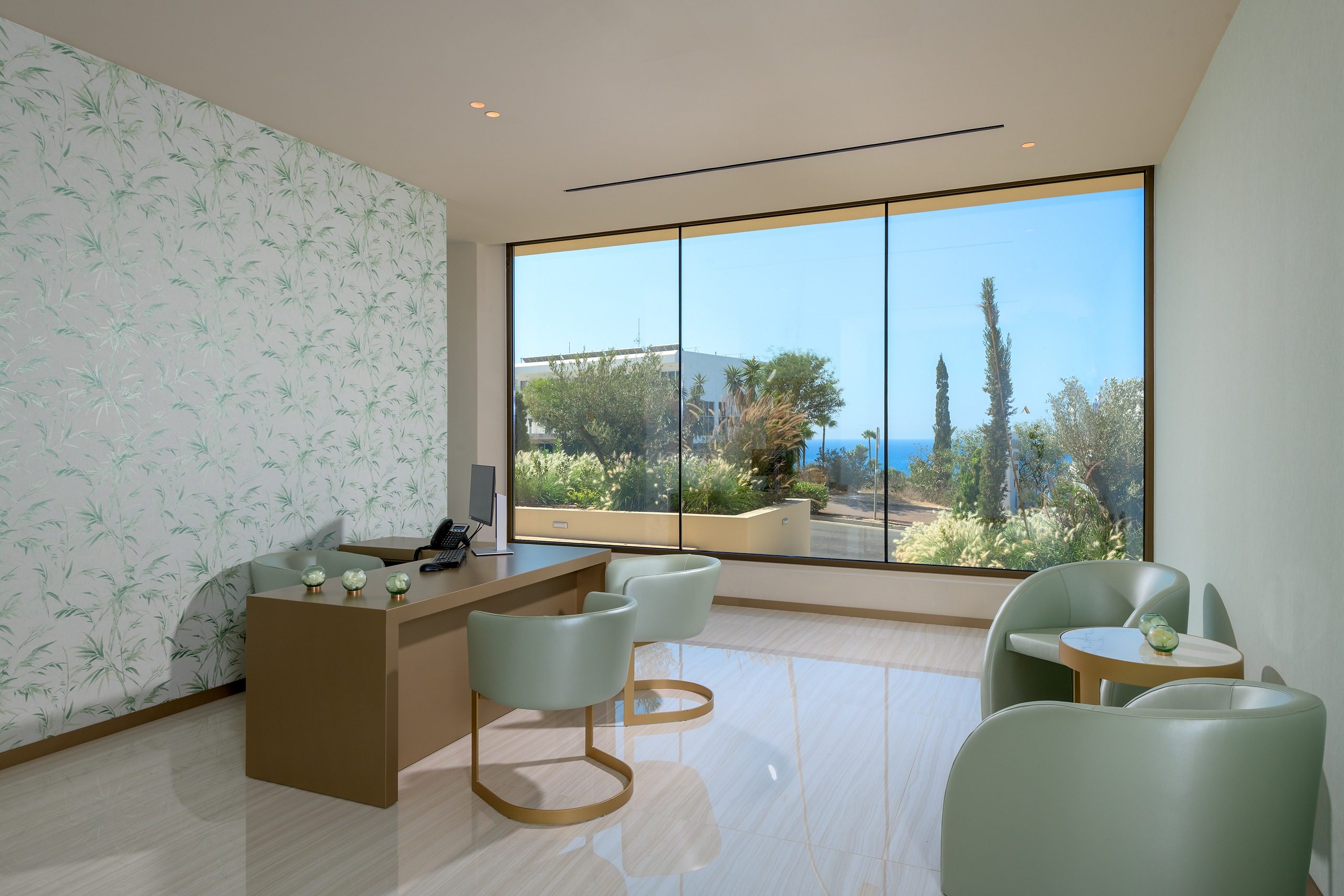 Modern living room with large window offering scenic outdoor views.