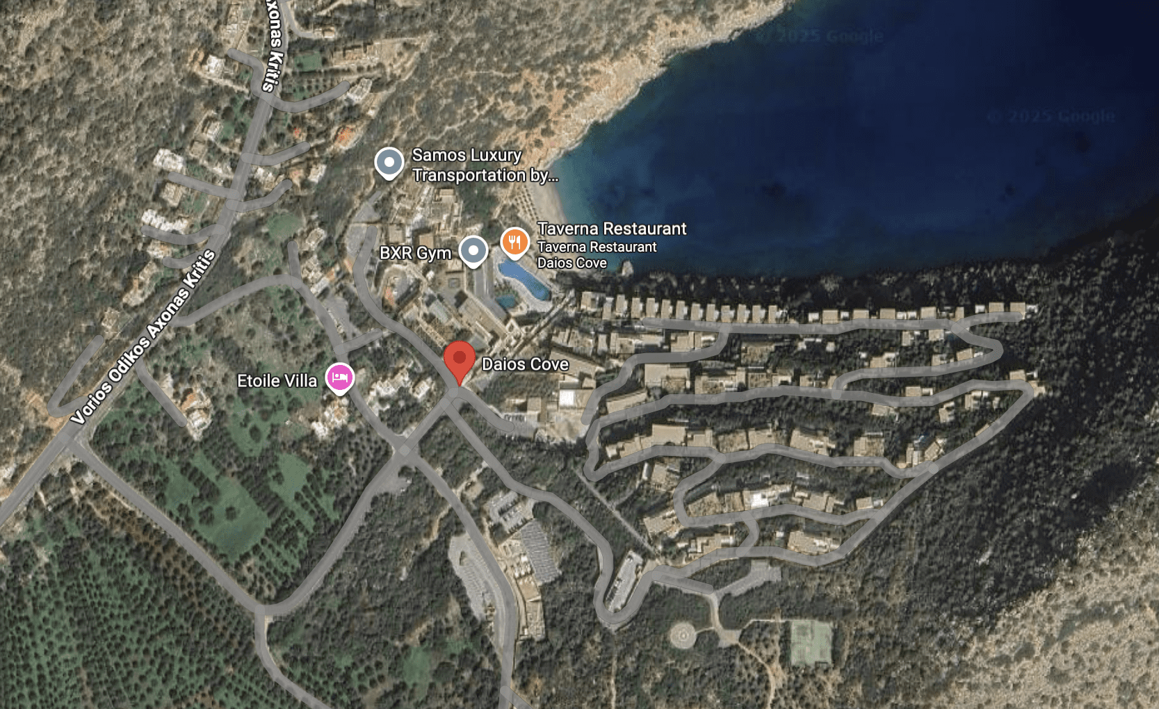 Aerial view of a coastal resort with buildings and a marina.
