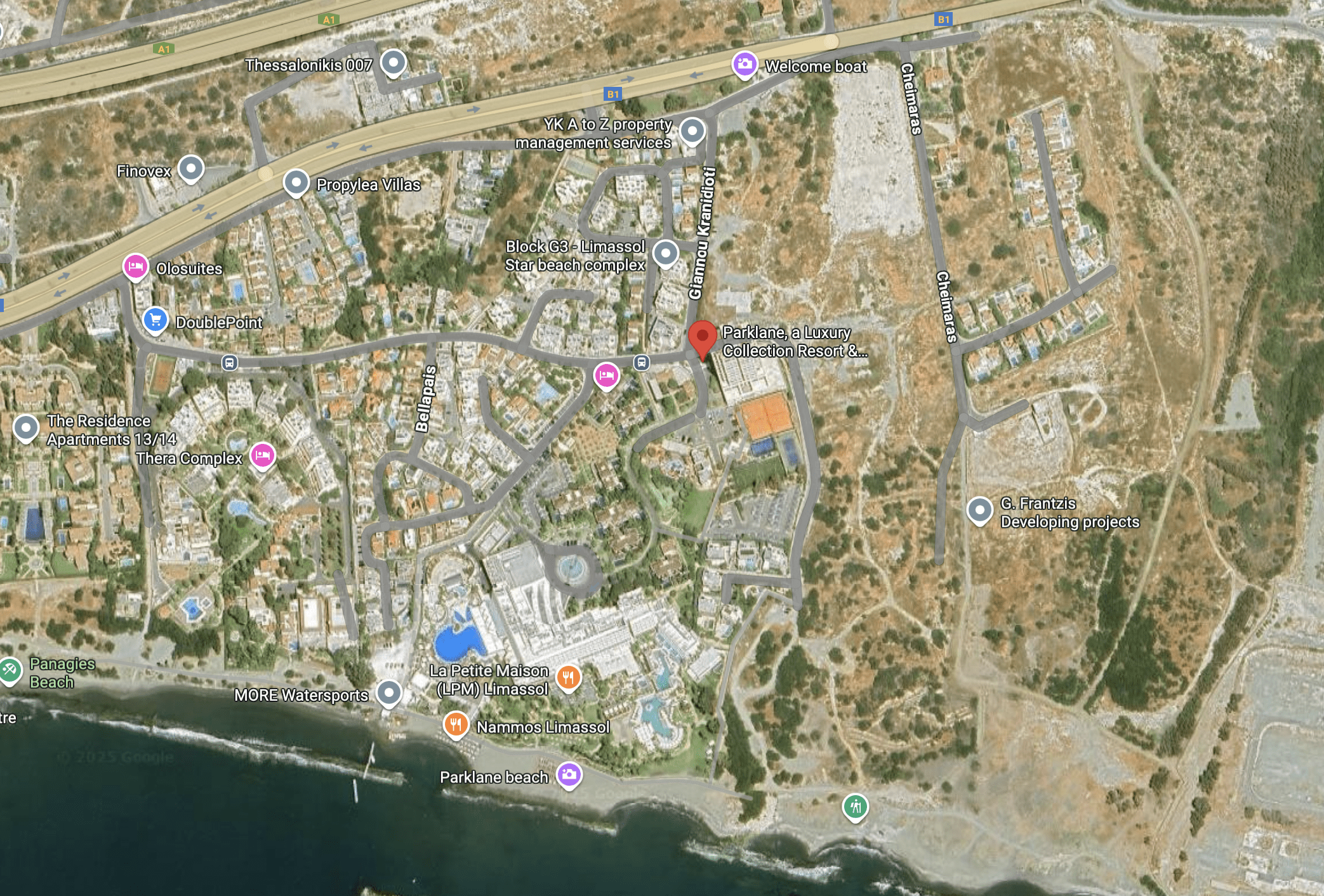 Aerial view of a coastal town with residential and commercial areas.