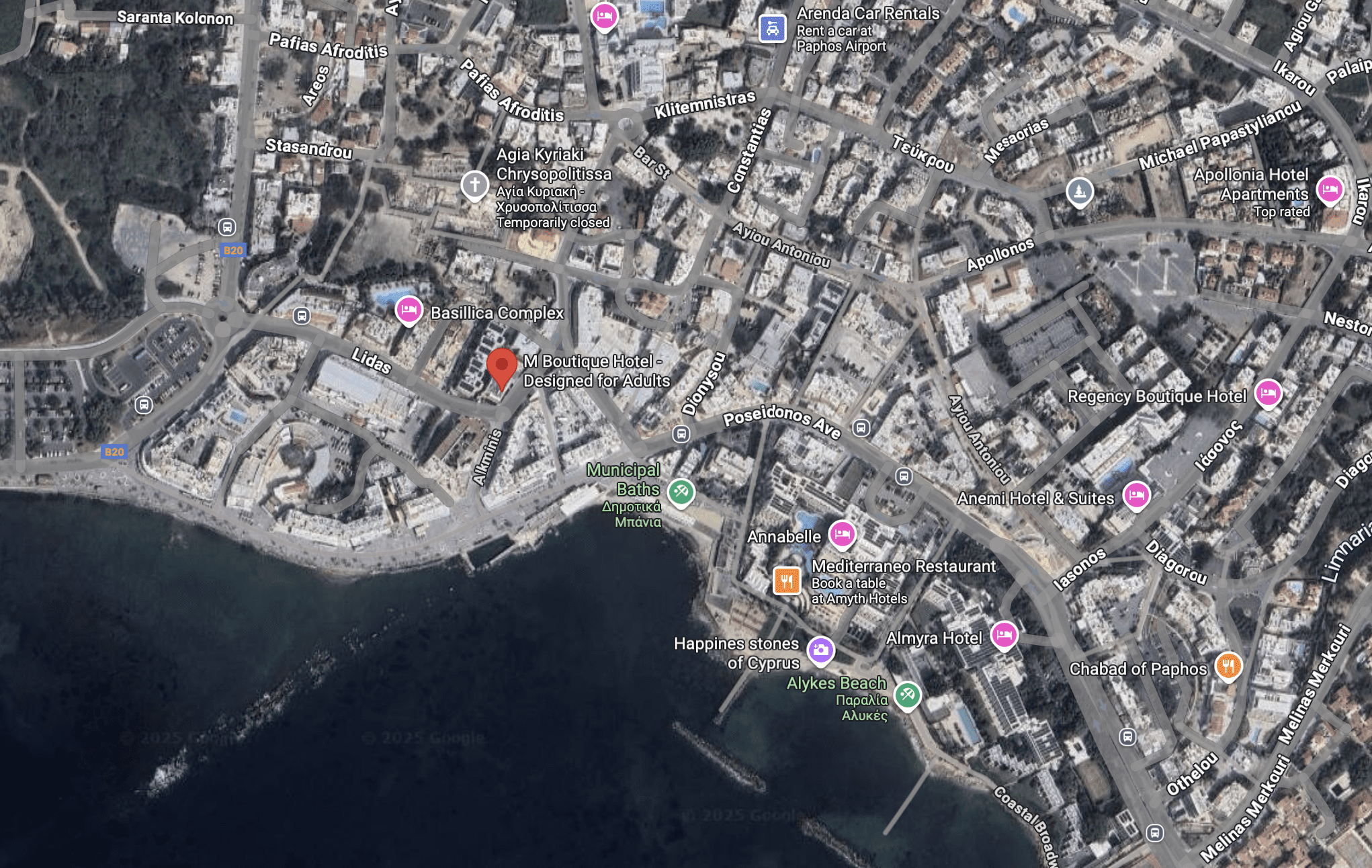 Aerial view of a coastal city with dense buildings and waterfront.