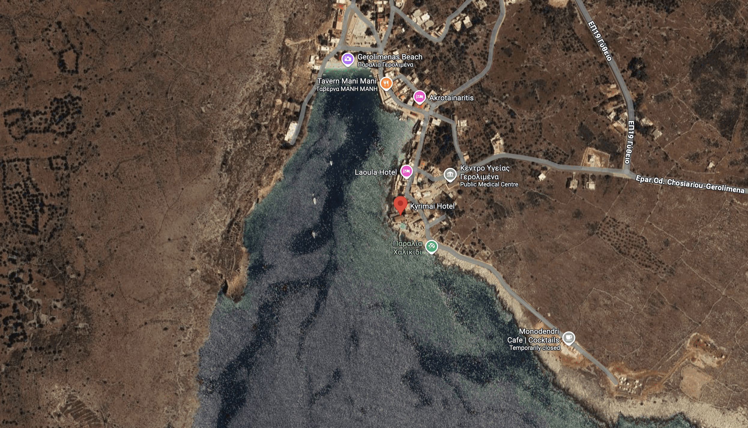 Aerial view of a coastal area with buildings and docks.