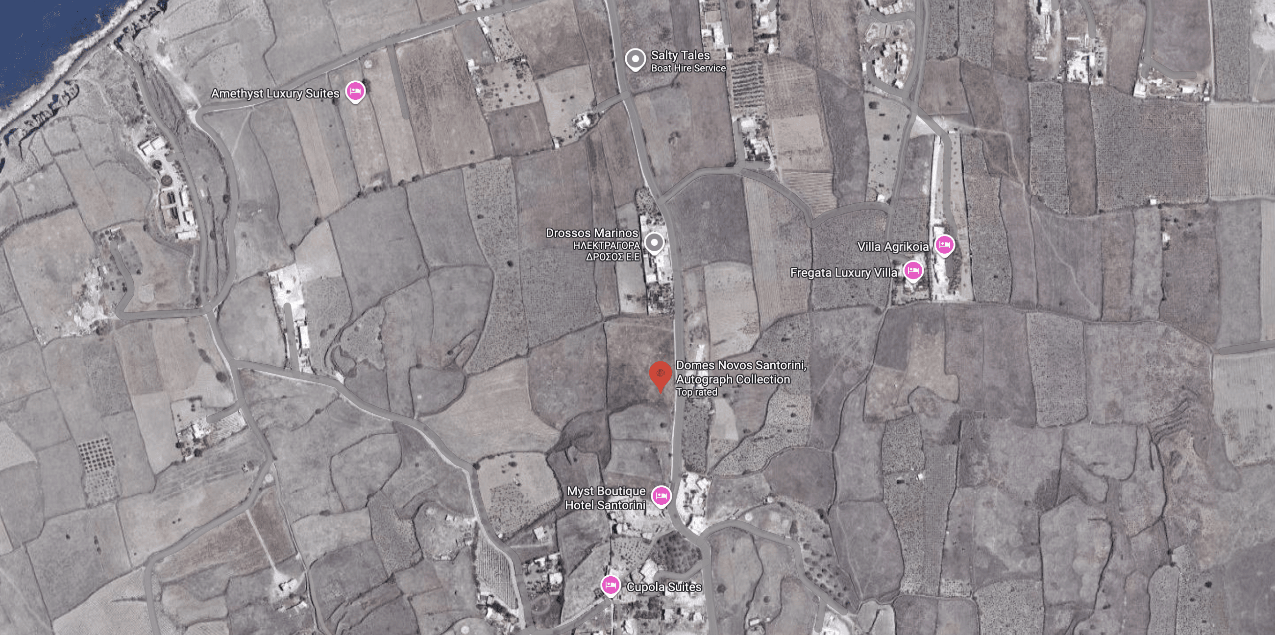 Aerial view of rural farmland with fields and roads.