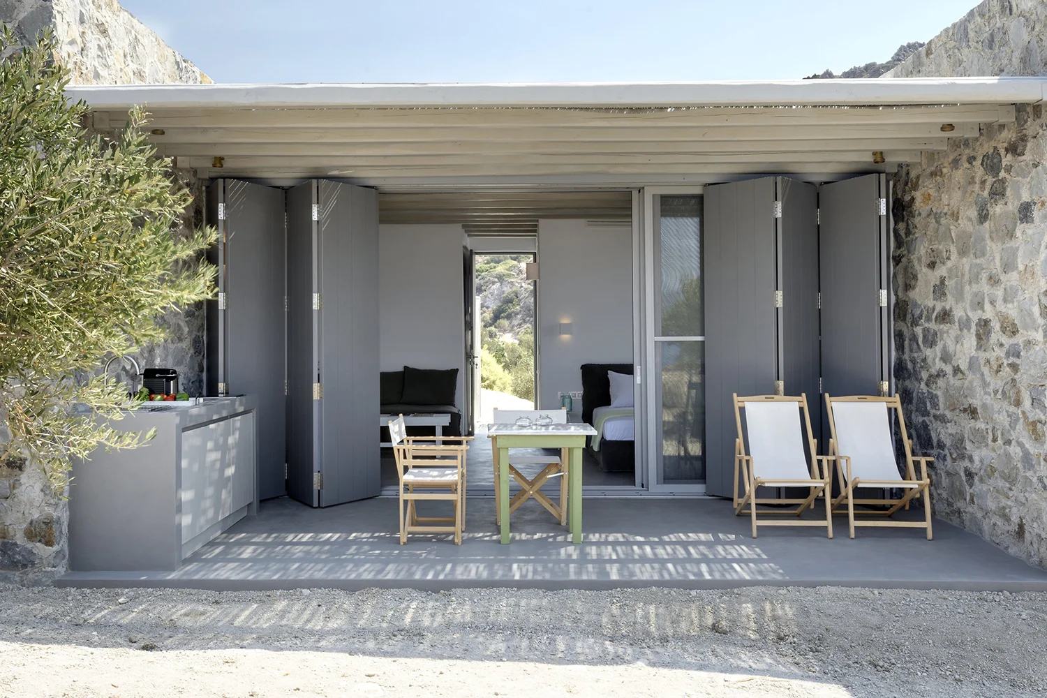 Modern outdoor seating area with neutral tones and natural light.