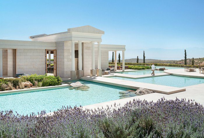 Elegant modern villa with a large pool and panoramic views.