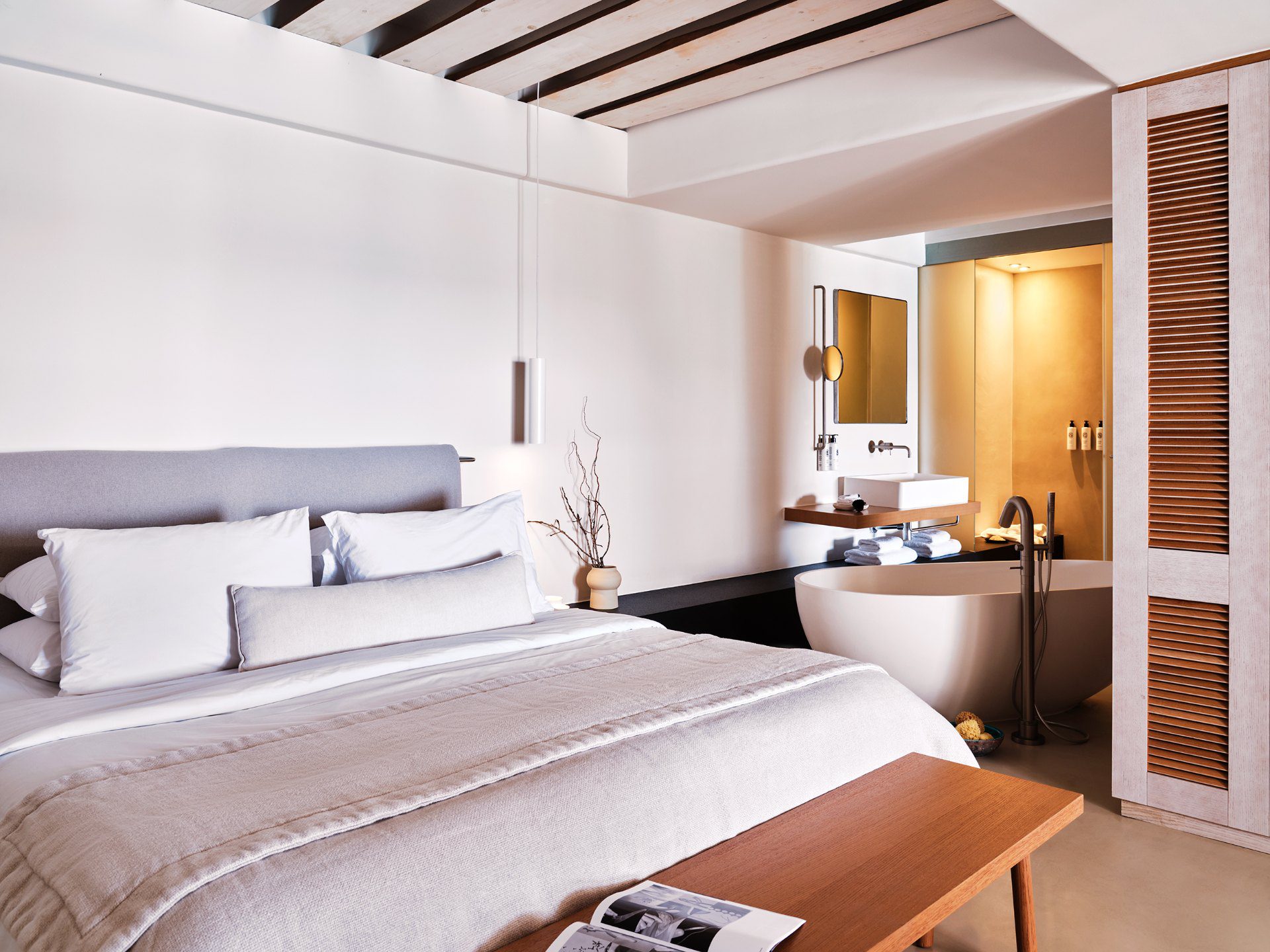 Modern bedroom with neutral tones and minimalist design.