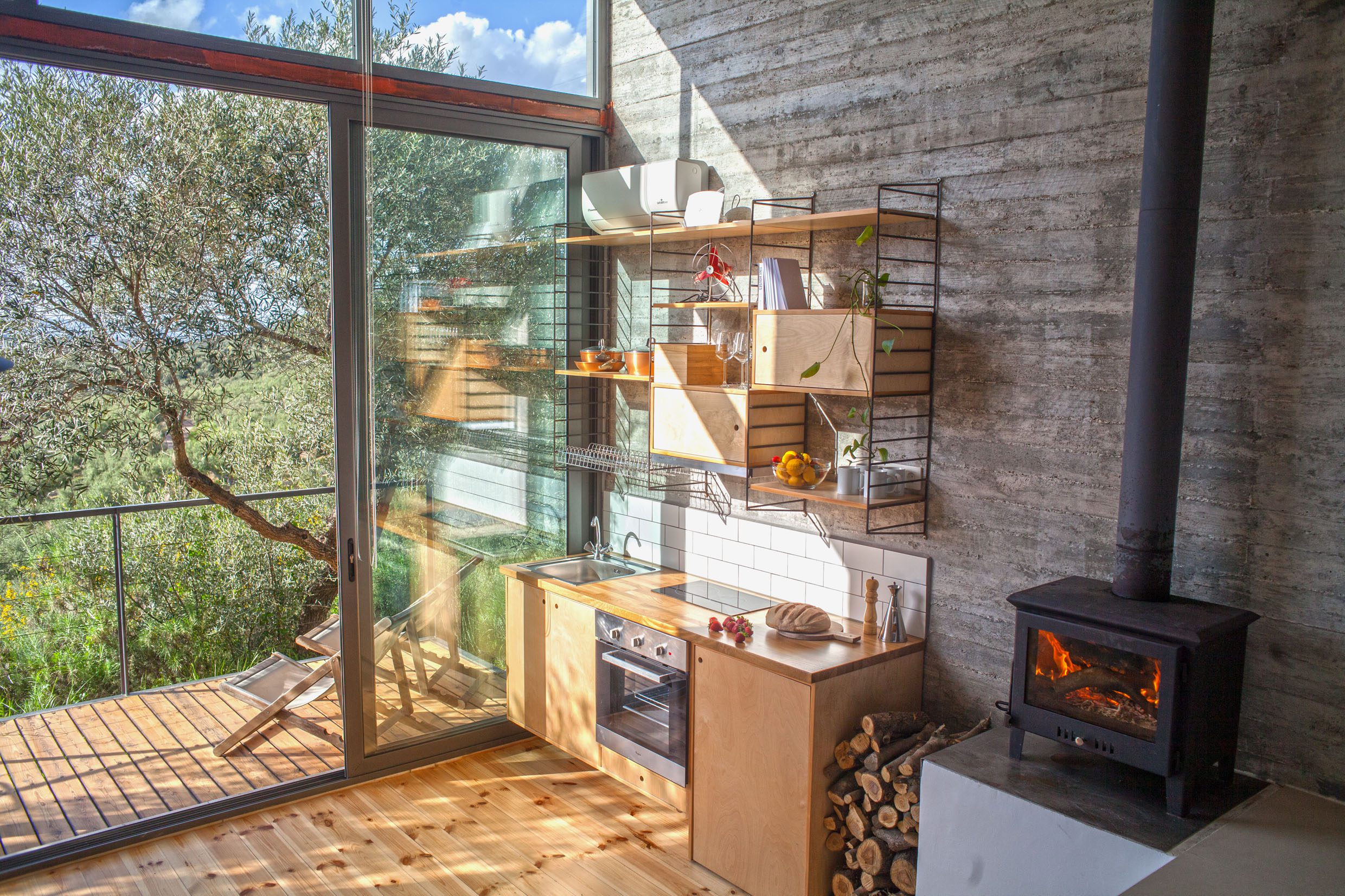 Cozy kitchen with natural light and rustic decor.