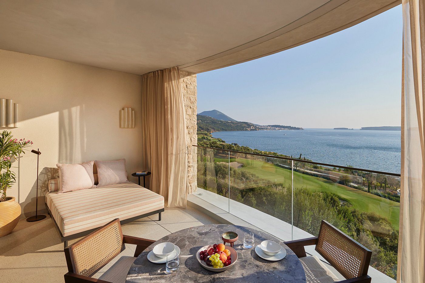 Cozy room with a scenic ocean view and breakfast setup.
