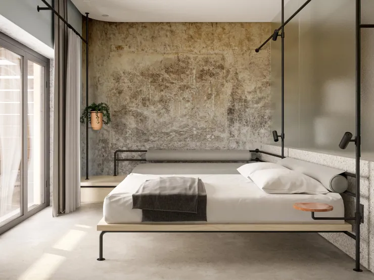 Minimalist bedroom with a simple bed and textured wall.