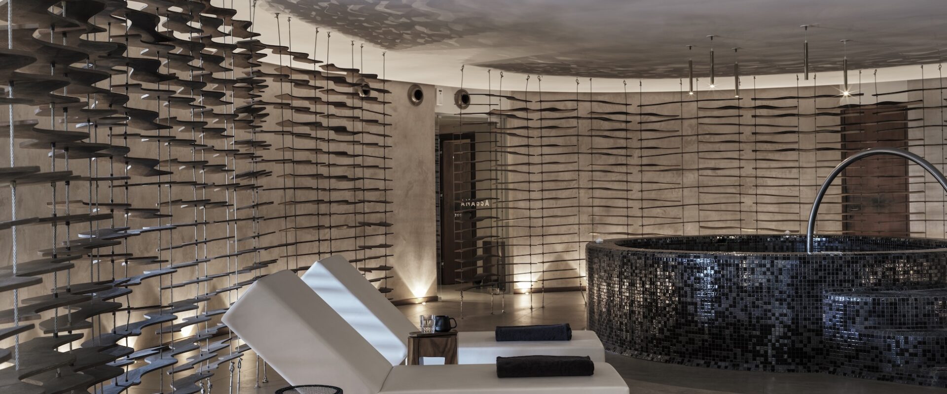 Luxurious indoor spa with reclining chairs and ambient lighting.
