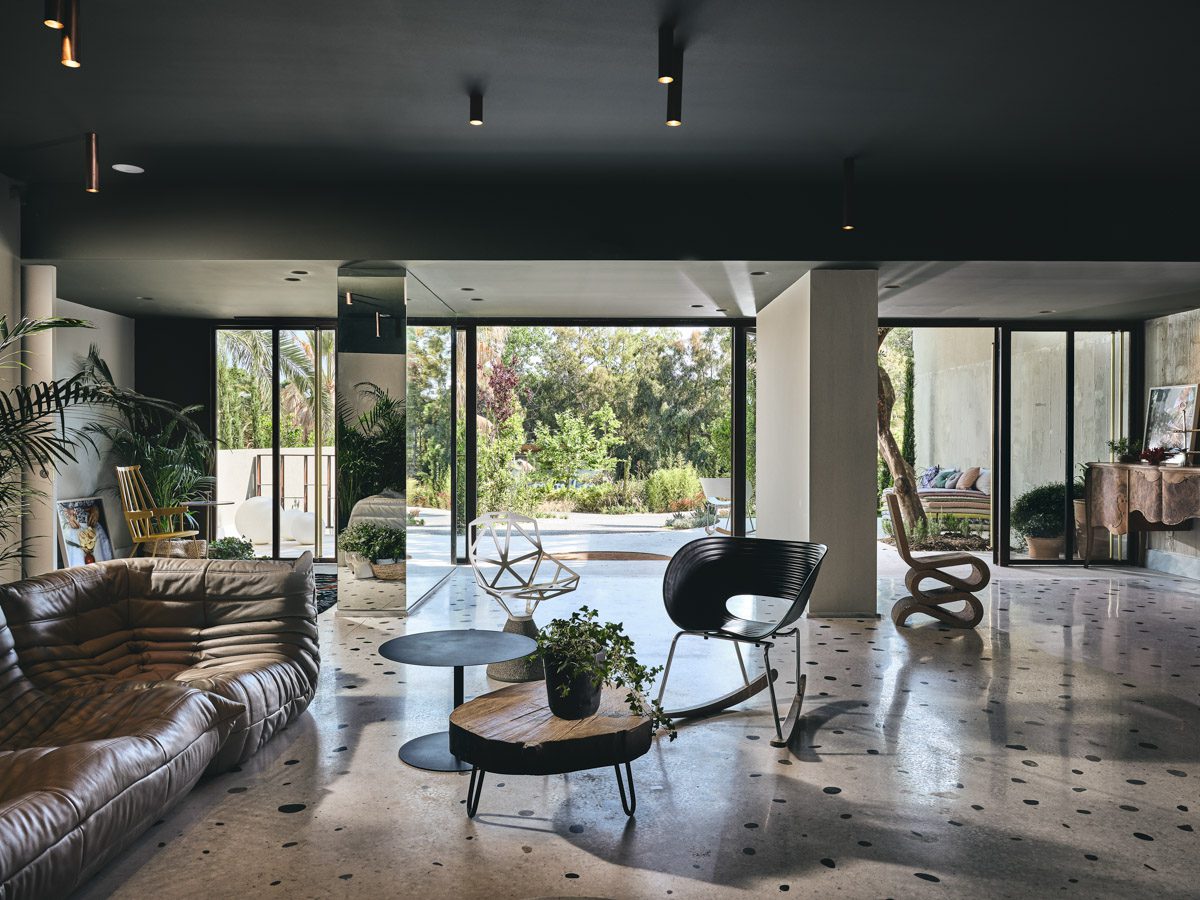 Modern living room with large windows and natural light.