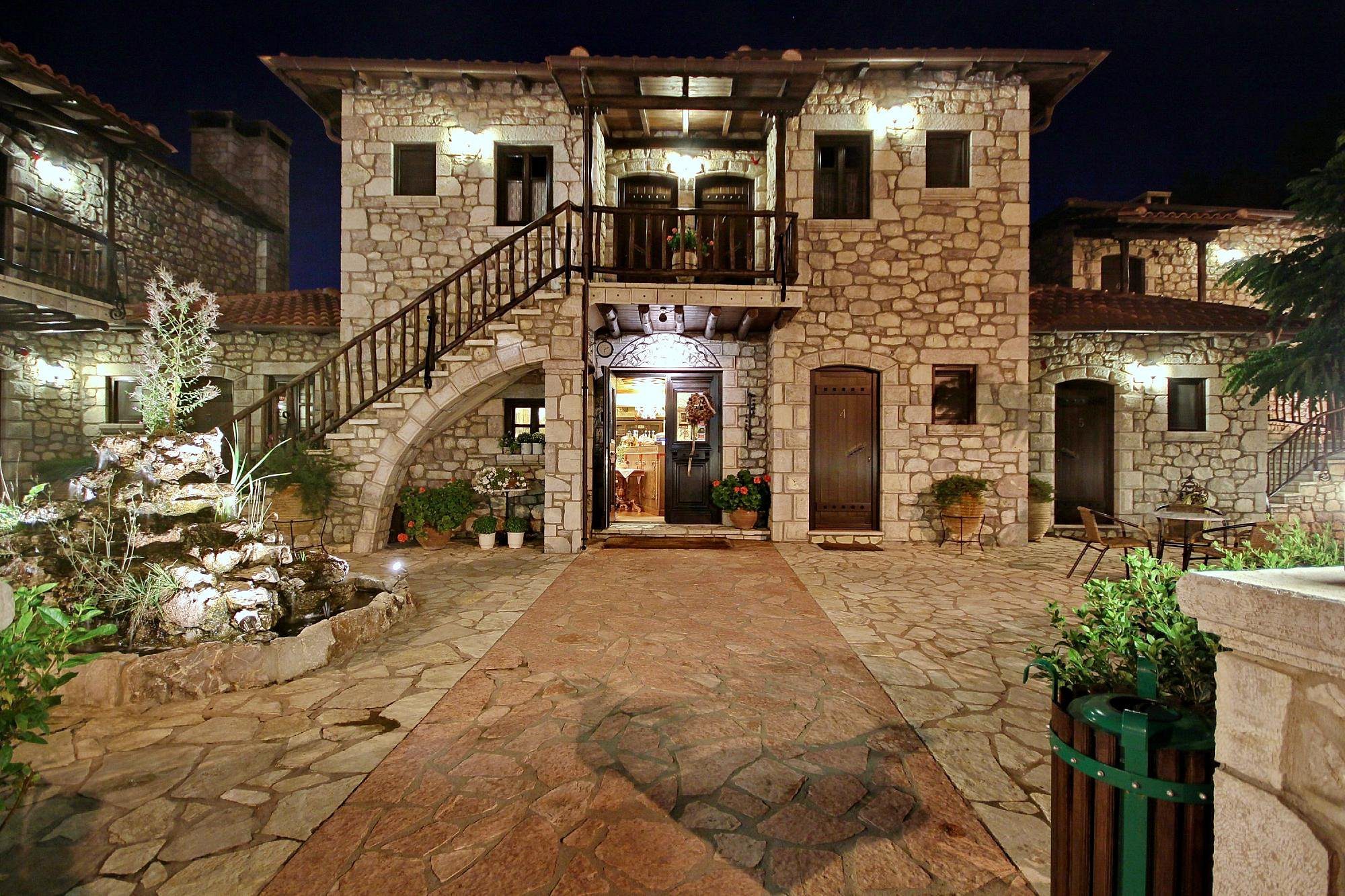 Stone building with rustic charm illuminated at night.