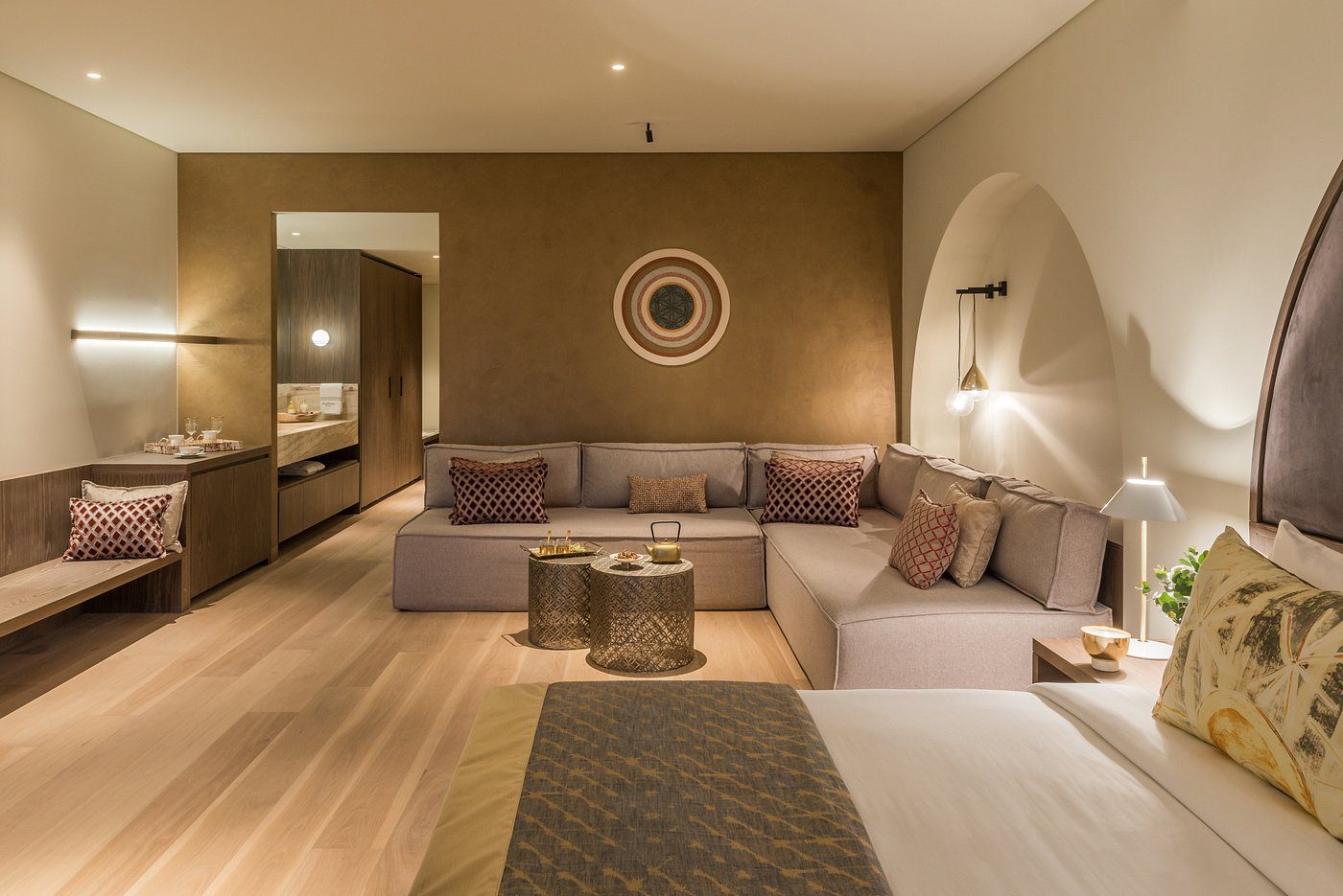 Cozy modern living room with neutral tones and ambient lighting.
