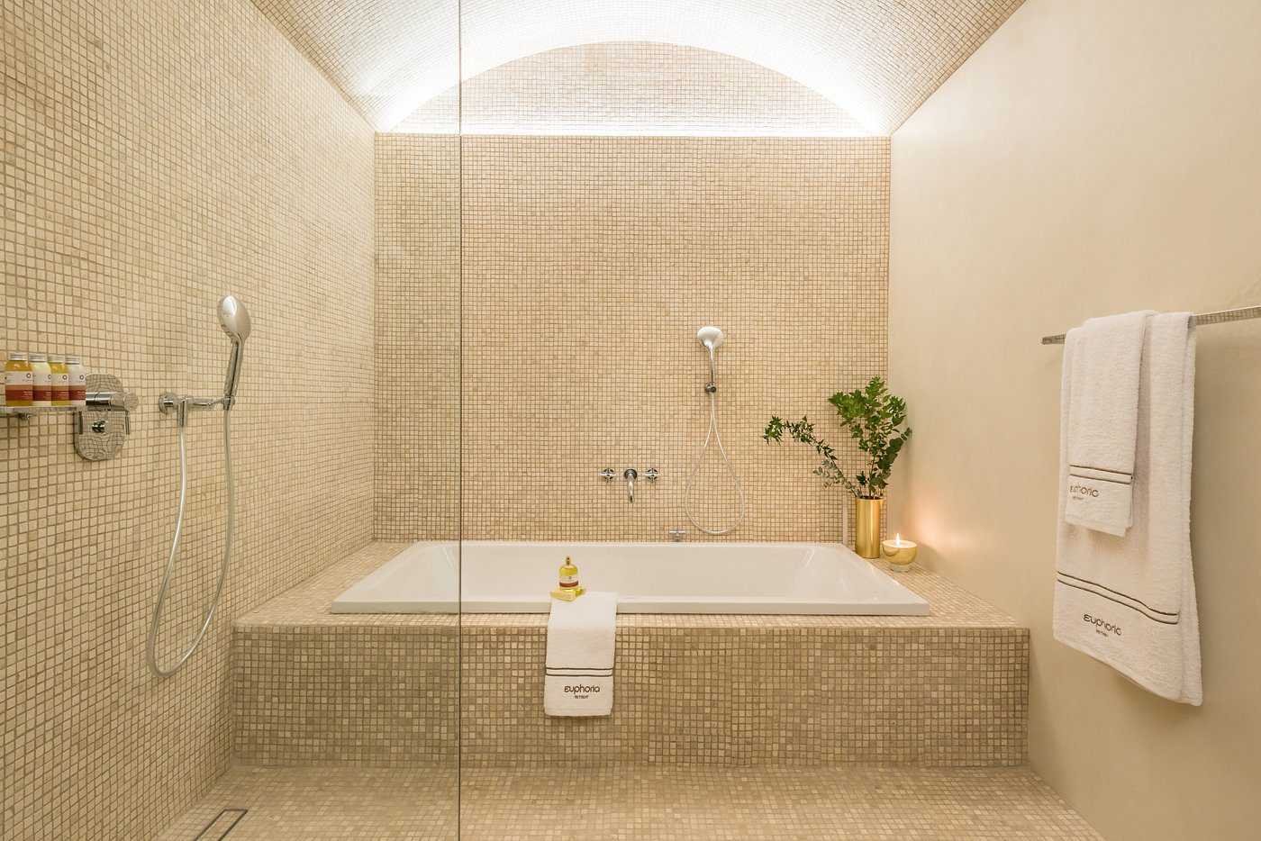 Minimalist bathroom with a deep soaking tub and soft lighting.