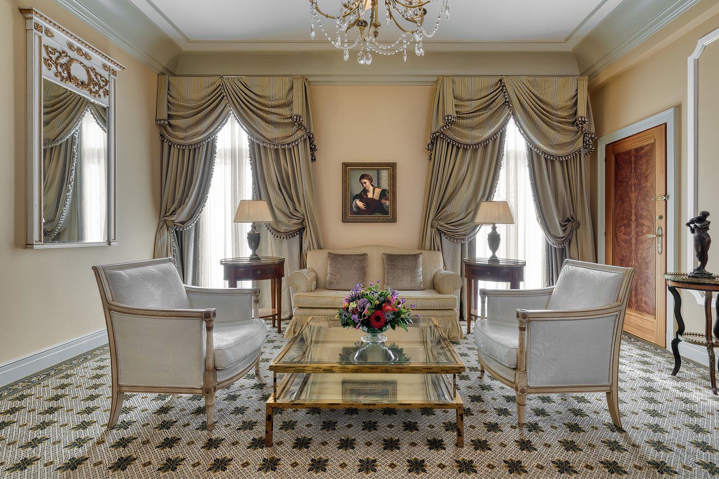 Elegant living room with classic furniture and ornate curtains.