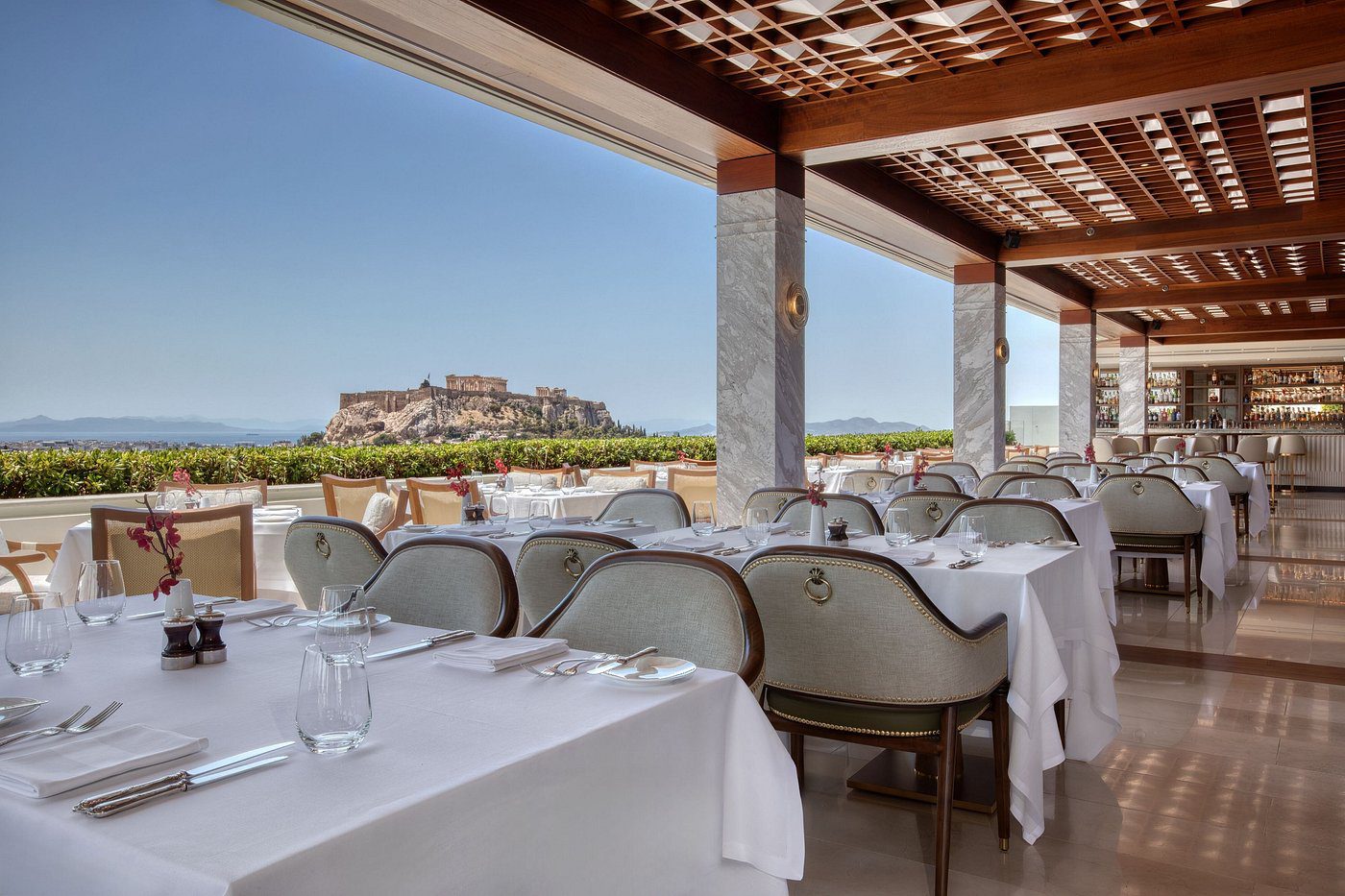 Elegant outdoor dining area with a scenic hilltop view.