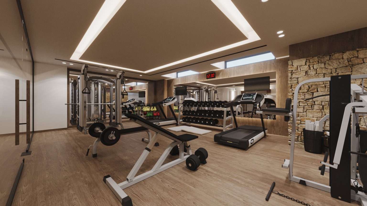 Modern home gym with various workout equipment and warm lighting.
