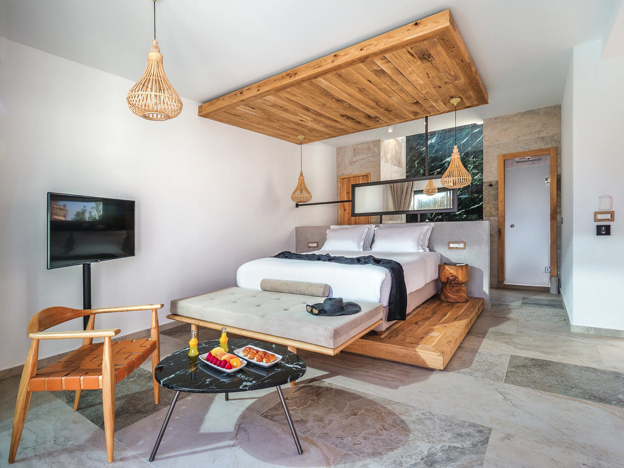 Modern bedroom with wooden ceiling accents and minimalist decor.