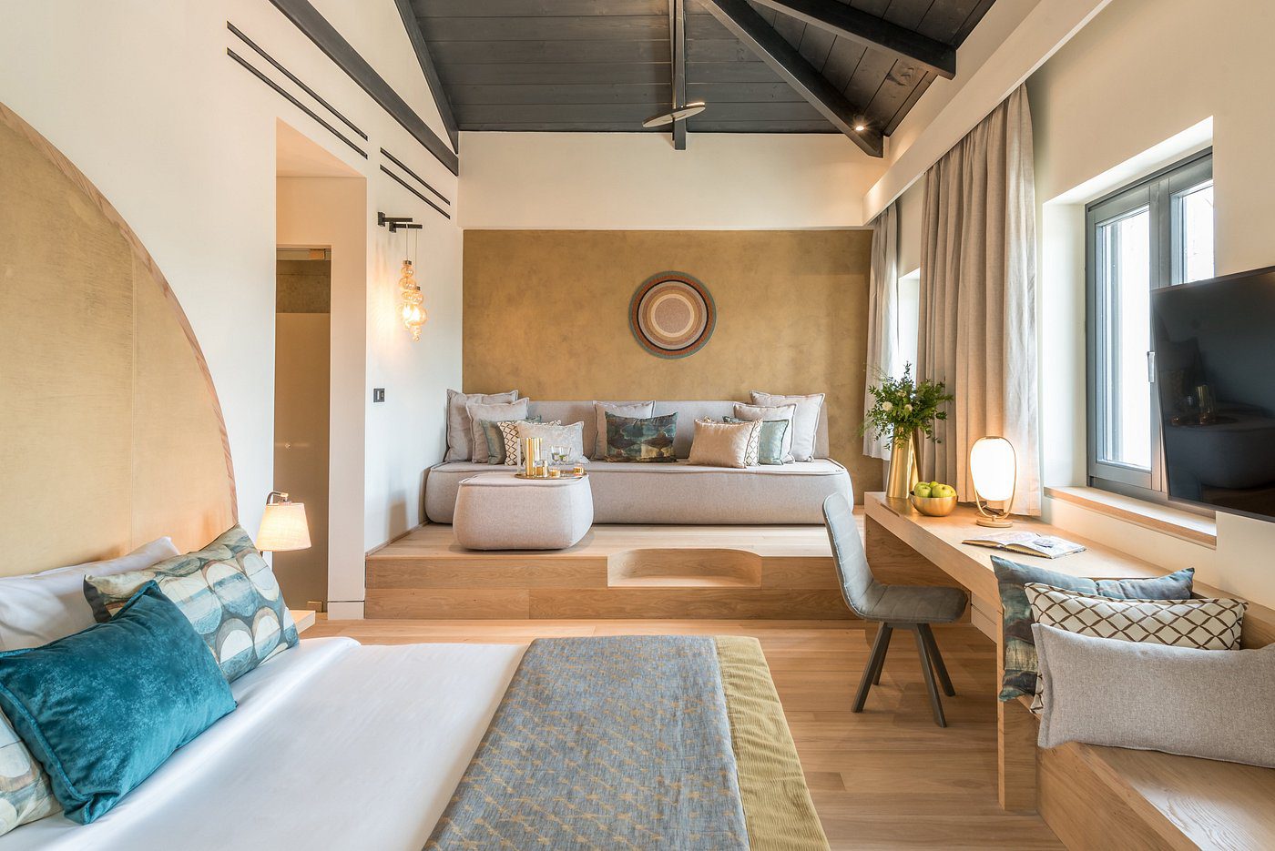 Cozy bedroom with modern decor and warm lighting.