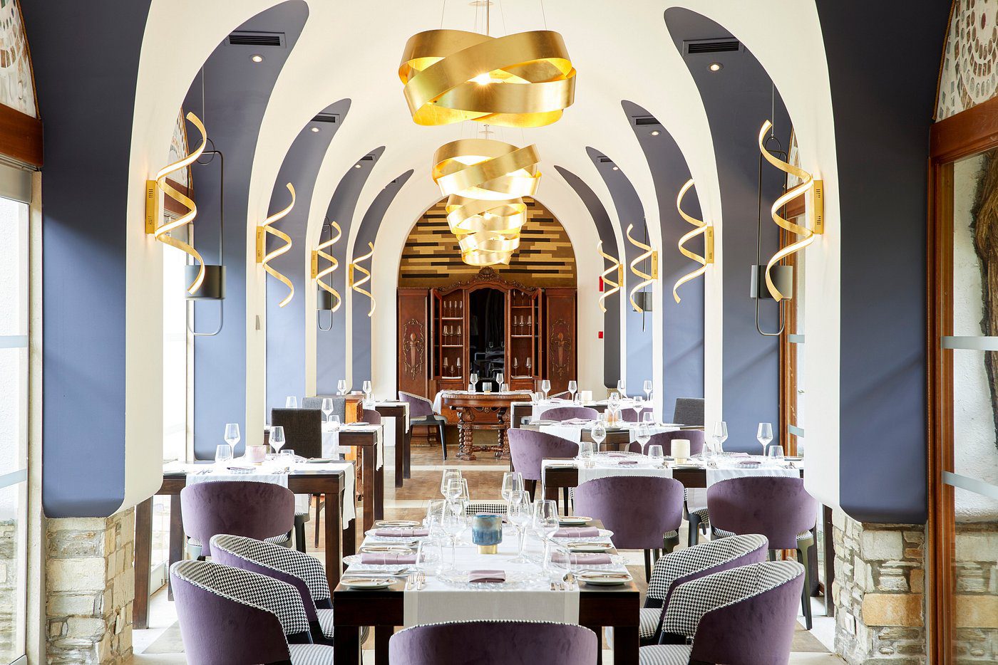 Elegant dining area with modern lighting and stylish seating.