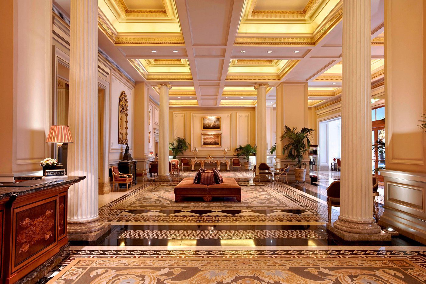 Elegant hotel lobby with luxurious decor and warm lighting.