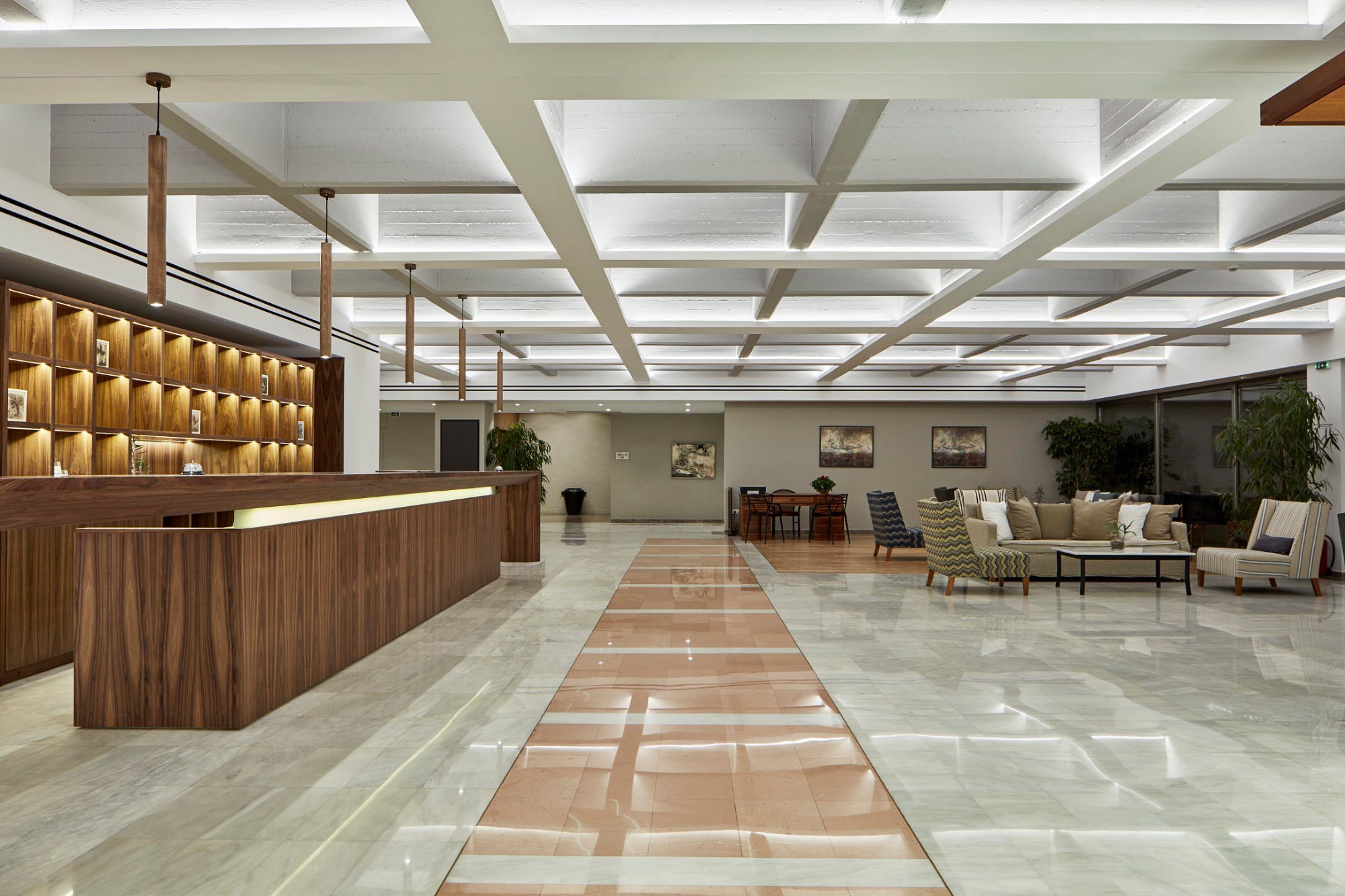Spacious modern lobby with stylish seating and wooden accents.
