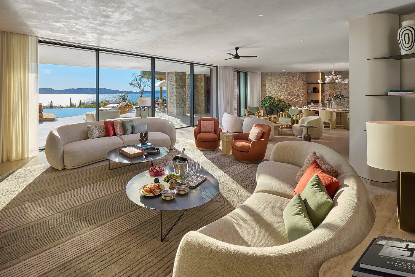 Spacious modern living room with ocean view and comfortable seating.