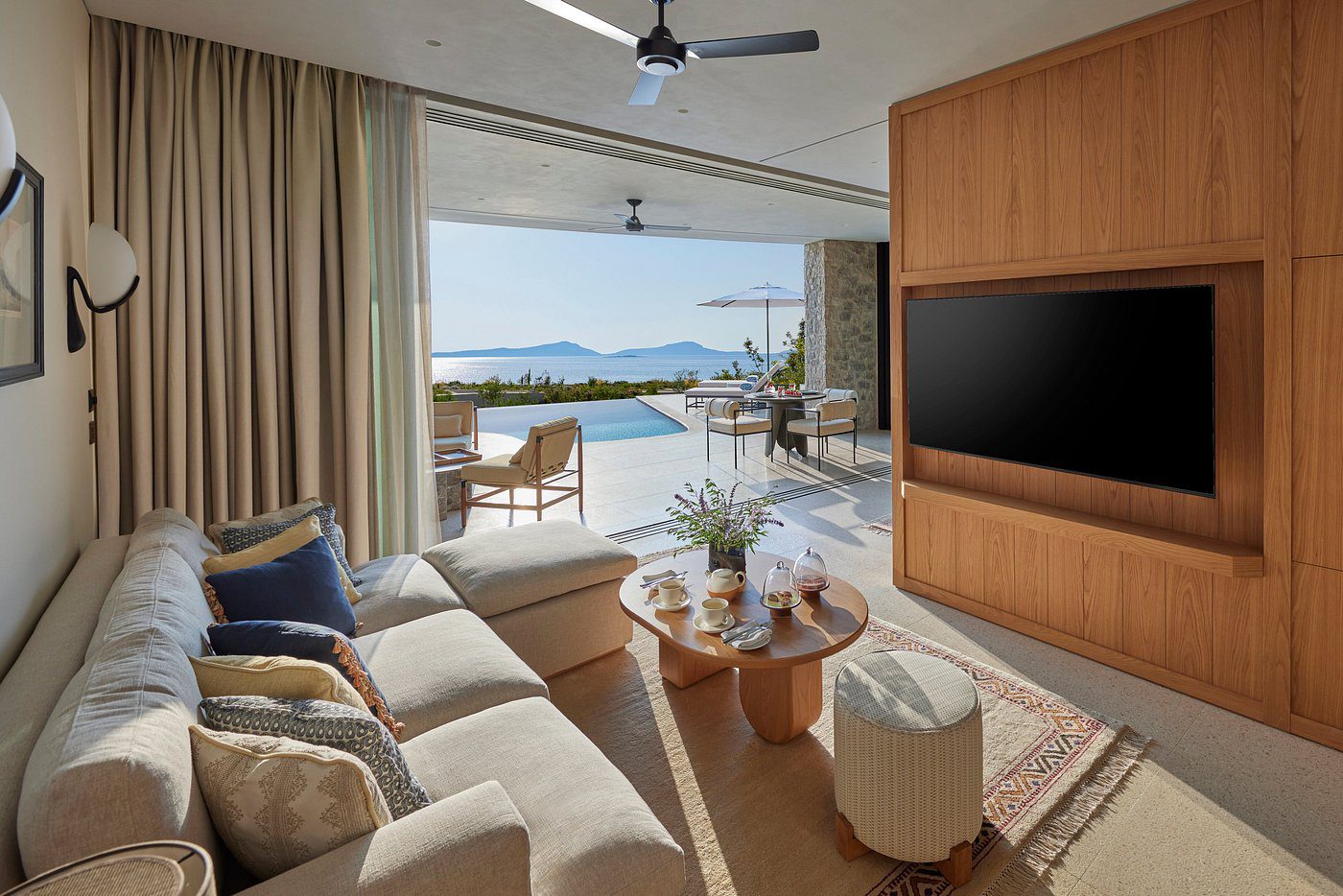 Cozy living room with ocean view and modern decor.
