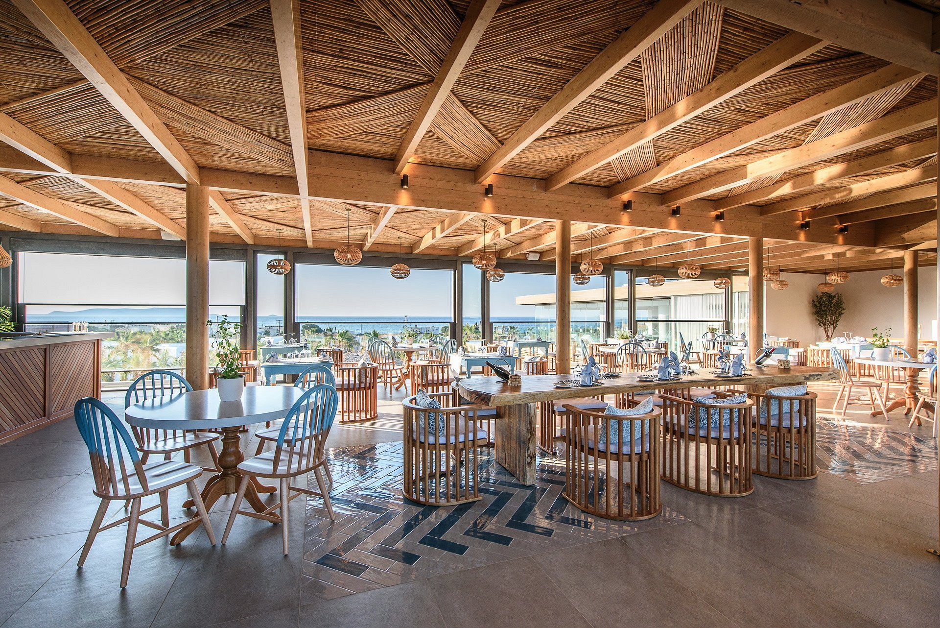 Cozy beachside restaurant with wooden decor and ocean views.