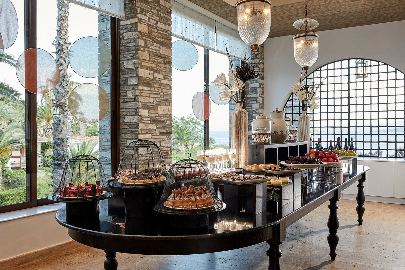 Elegant buffet setup in a modern dining area with natural light.