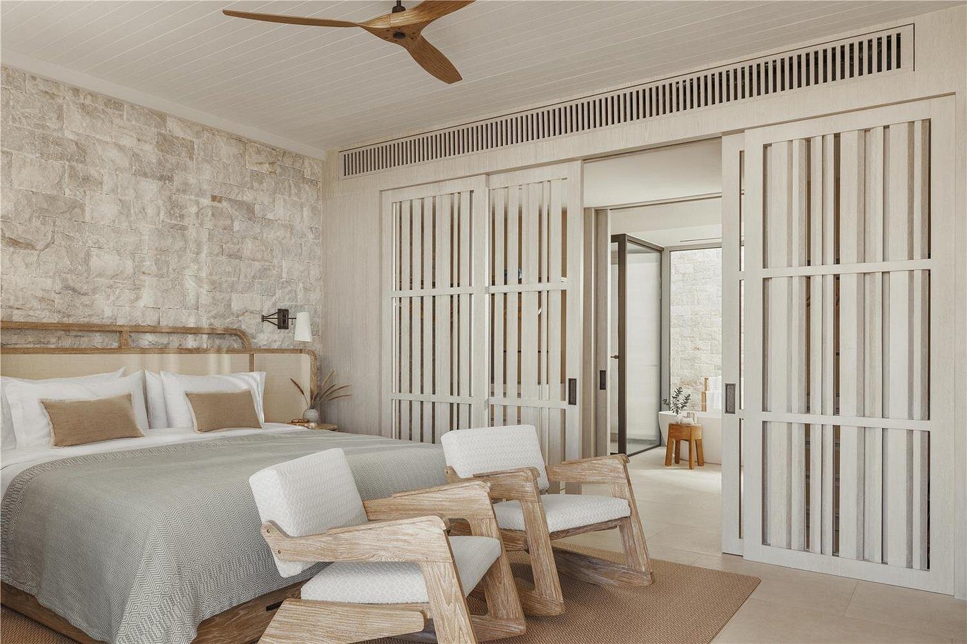 Cozy modern living room with wooden armchairs and neutral tones.